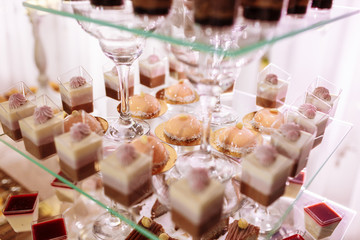 Wedding candy bar with a lot of different desserts. Selective focus.