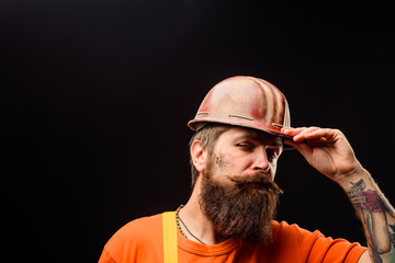 Builder in hard hat. Man builder. Bearded man in overalls and construction helmet. Mechanical worker. Industrial worker. Construction worker in hardhat. Business, building, industry, technology.