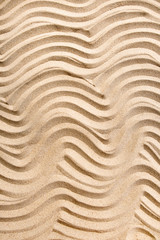 Fototapeta na wymiar Texture line wave sand on the beach, nature background, top view, vertical composition