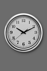 Round metal clock on Grey wall
