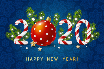 New Year concept - 2020 candy numbers with Christmas decor on blue snowflakes background for winter holidays design