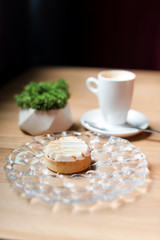 Cream tart with coffee. Dessert in cafe, selective focuse
