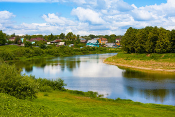 View on river and district with old wooden houses in Vologda. Russia