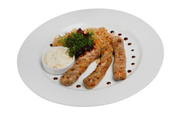 Raw pork sausages closeup view. Hunting grilled sausages on a plate isolated on white background
