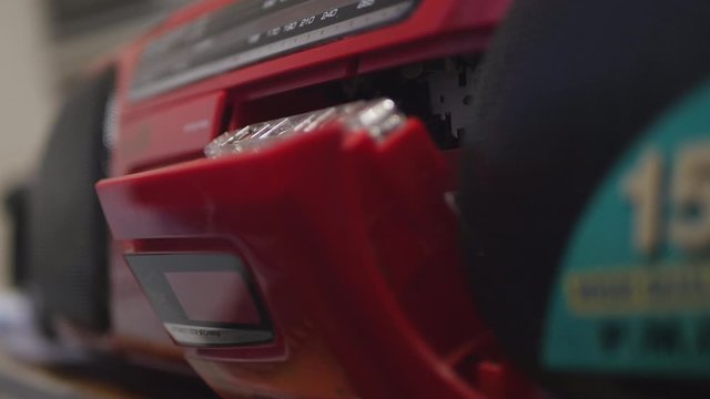 Man Pushing The Eject Button And Open Audio Cassette Door.