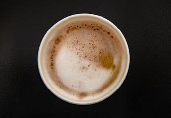 cup of coffee on black background