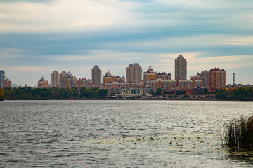 Fototapeta premium city skyline at sunset and boat
