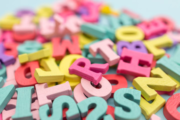 Alphabet wooden letters abstract on color background