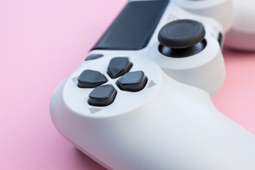 Obraz na płótnie Canvas Video games white gaming controller isolated on pink color background top view