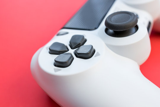 Video games white gaming controller isolated on red color background top view