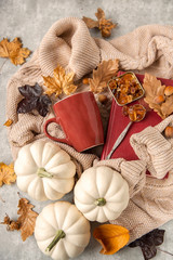 Autumn tea party. top outline of Cup, sugar crystals. Preparation for cold days. Pullover and autumn decoration . Declaration seasonal foliage and pumpkins .Autumn