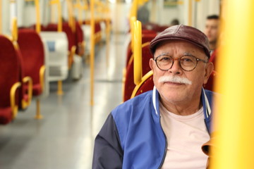 Senior Hispanic man using public transportation