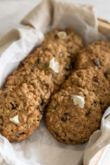 Vegan oatmeal cookies with raisin and nuts. Healthy vegan detox dessert on a light background. Close up