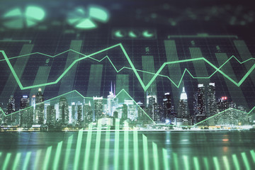 Financial graph on night city scape with tall buildings background multi exposure. Analysis concept.