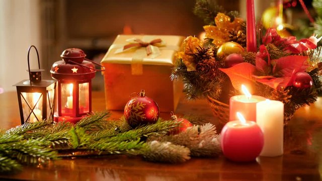 4k video of burning candles and fireplace in living room deocrated for celebrating Christmas and New Year. Perfect shot for winter celebrations and holidays