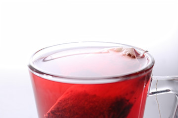 Teaglass, Teacup filled with red tea on a white background