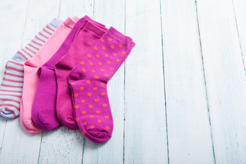 pink socks on white wooden