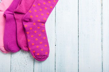 pink socks on white wooden