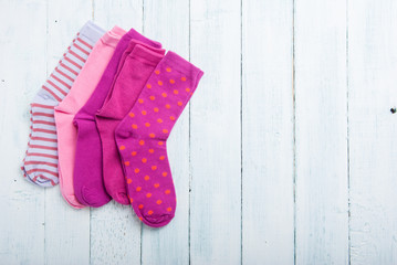 pink socks on white wooden