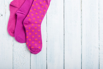 pink socks on white wooden