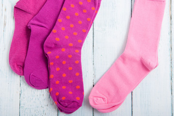 pink socks on white wooden