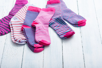 striped socks on white wooden