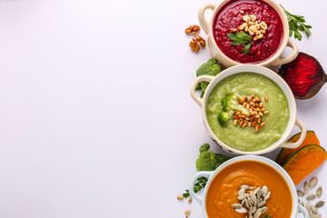 Variety of colorful vegetables cream soup: with broccoli, beets, and pumpkins, healthy eating concept, Copy space, Horizontal orientation