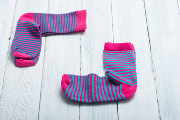striped socks frame background on white wooden