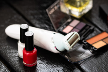Various cosmetics on a black background. Beauty products, close up photo.