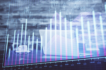 Stock market chart hologram drawn on personal computer background. Multi exposure. Concept of investment.