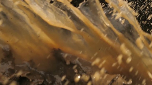 Mud splash from under the wheels of a car