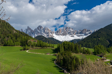 Fototapeta na wymiar Amazing landscape of val di funes in south Tyrol, Italy. Famous tourist spot at Santa Maddalena church with background of Dolomites rocky mountain.