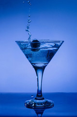 blue cocktail with splash isolated on white