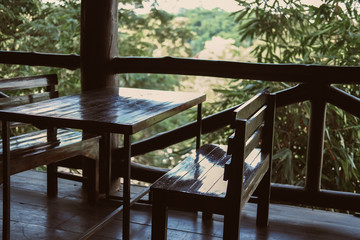 wooden chair in terrace balcony with garden view.