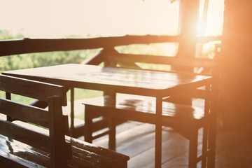wooden chair in terrace balcony with garden view.