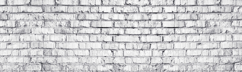 Whitewashed brick wall panoramic texture. White old brickwork masonry long panorama. Widescreen light grey background
