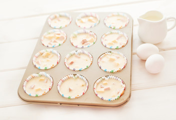 ham and cheese muffins on white wooden background