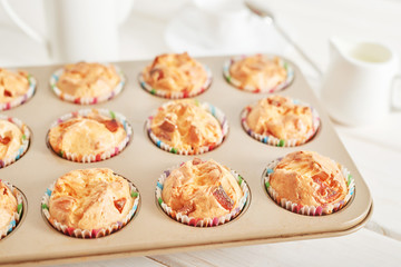 ham and cheese muffins on white wooden background