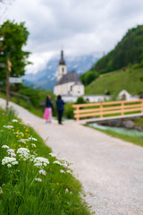 Famouse tourist spot in Berchtesgaden, Germany. Bridge near St. Sebastian church. with background of mountains of Bavarian alps.