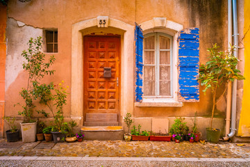 Fototapeta na wymiar View of a narrow street in the historical center of Arles