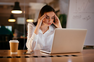 Portrait of tired businesswoman