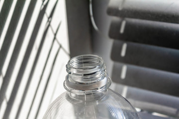 Bottle neck near jalousie in the sun