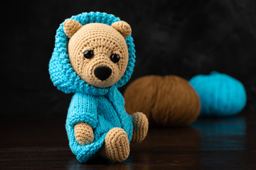 Funny knitted toy bear. Amigurumi toy. Crochet stuffed animals.