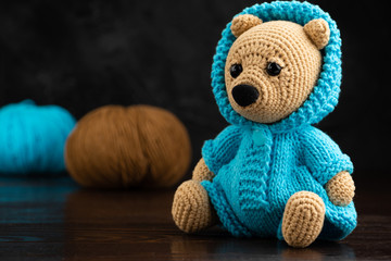 Funny knitted toy bear. Amigurumi toy. Crochet stuffed animals.