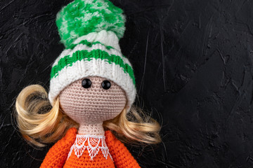Fototapeta premium Knitted toy doll. Amigurumi toy. Crochet stuffed animals.