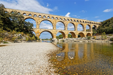 Fototapeta premium REMOULINS, FRANCE, SEPTEMBER 20, 2019 : The Pont du Gard, the highest Roman aqueduct bridge, and one of the most preserved, was built in the 1st century, added to list of World Heritage Sites in 1985.