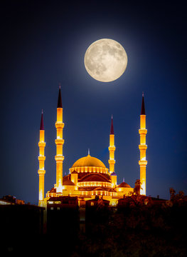 Kocatepe Mosque at night under full moon, Ankara, Turkey.