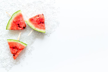 Popsicle from fresh watermelon and ice on white background top view space for text