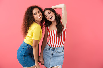 Image of alluring multinational girls smiling together at camera