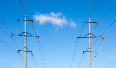 Two symmetrically located concrete power line poles